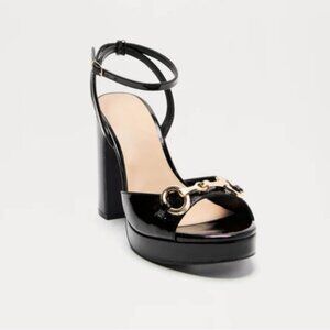 Black block heels with gold buckle